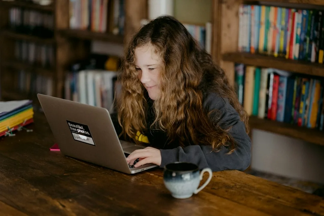 A young learner completing schoolwork at home